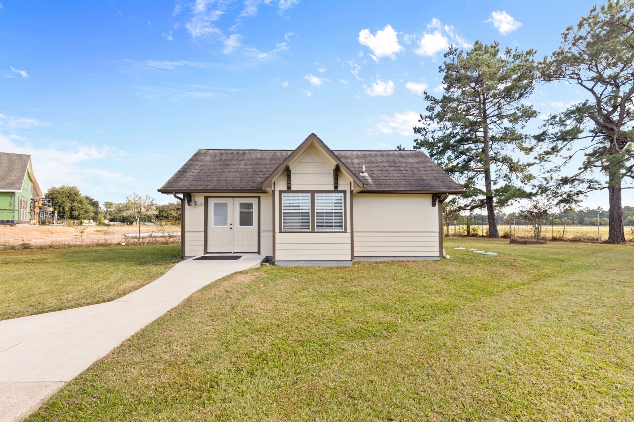 24236 Stuebner Airline Road Tomball, TX 77375 - Photo 27 of 39 a front view of house with yard and swimming pool