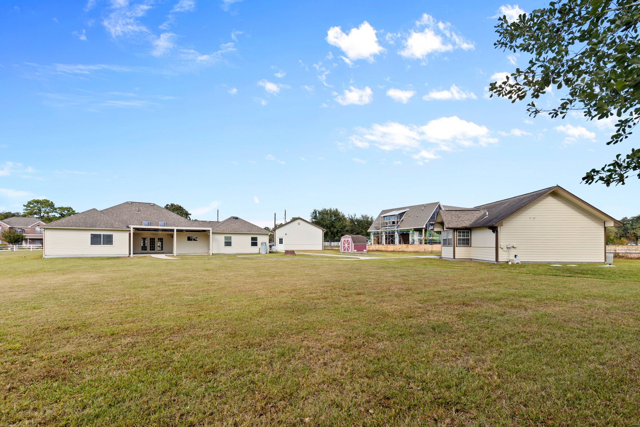 24236 Stuebner Airline Road Tomball, TX 77375 - Photo 34 of 39 a view of a large house with a big yard and large trees