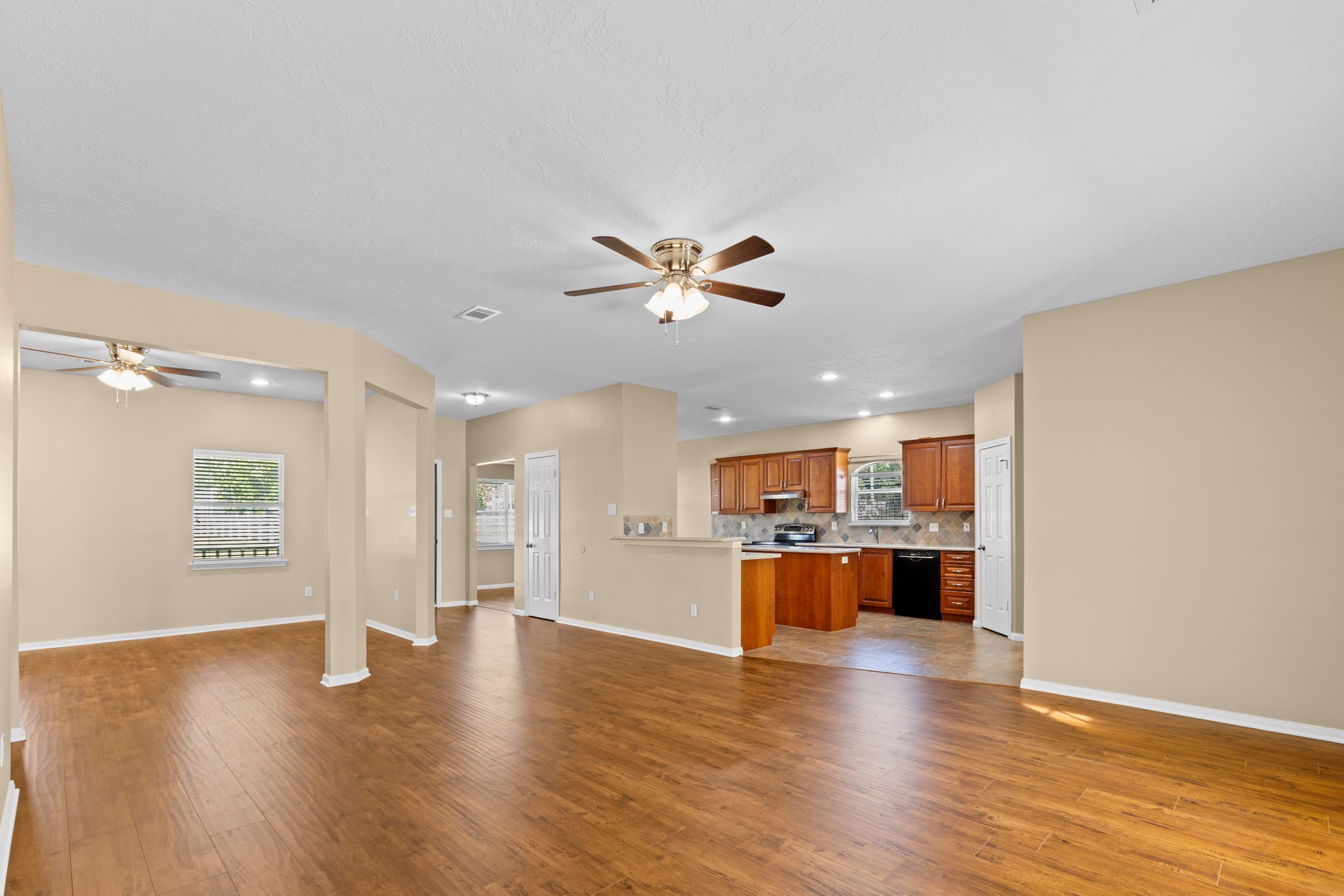24236 Stuebner Airline Road Tomball, TX 77375 - Photo 39 of 39 a view of a kitchen with a sink and a stove top oven