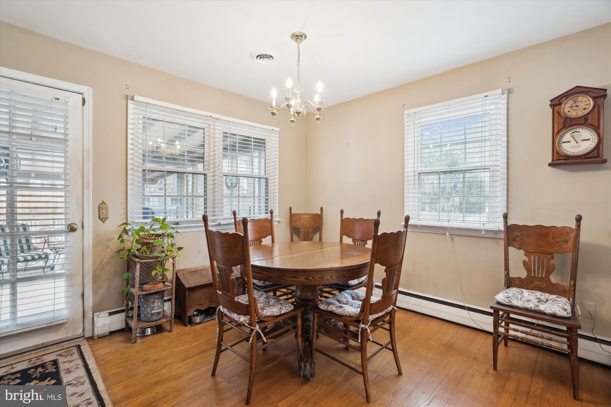 11319 Harding Road Laurel, MD 20723 - Photo 12 of 44 a view of a dining room with furniture window and wooden floor