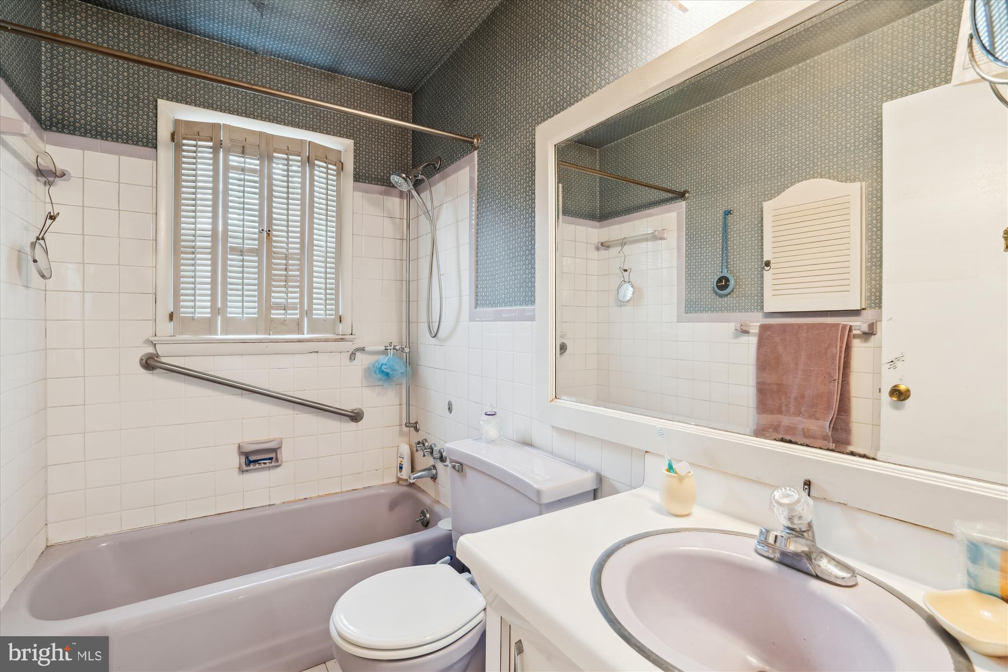 11319 Harding Road Laurel, MD 20723 - Photo 18 of 44 a bathroom with a sink toilet and shower