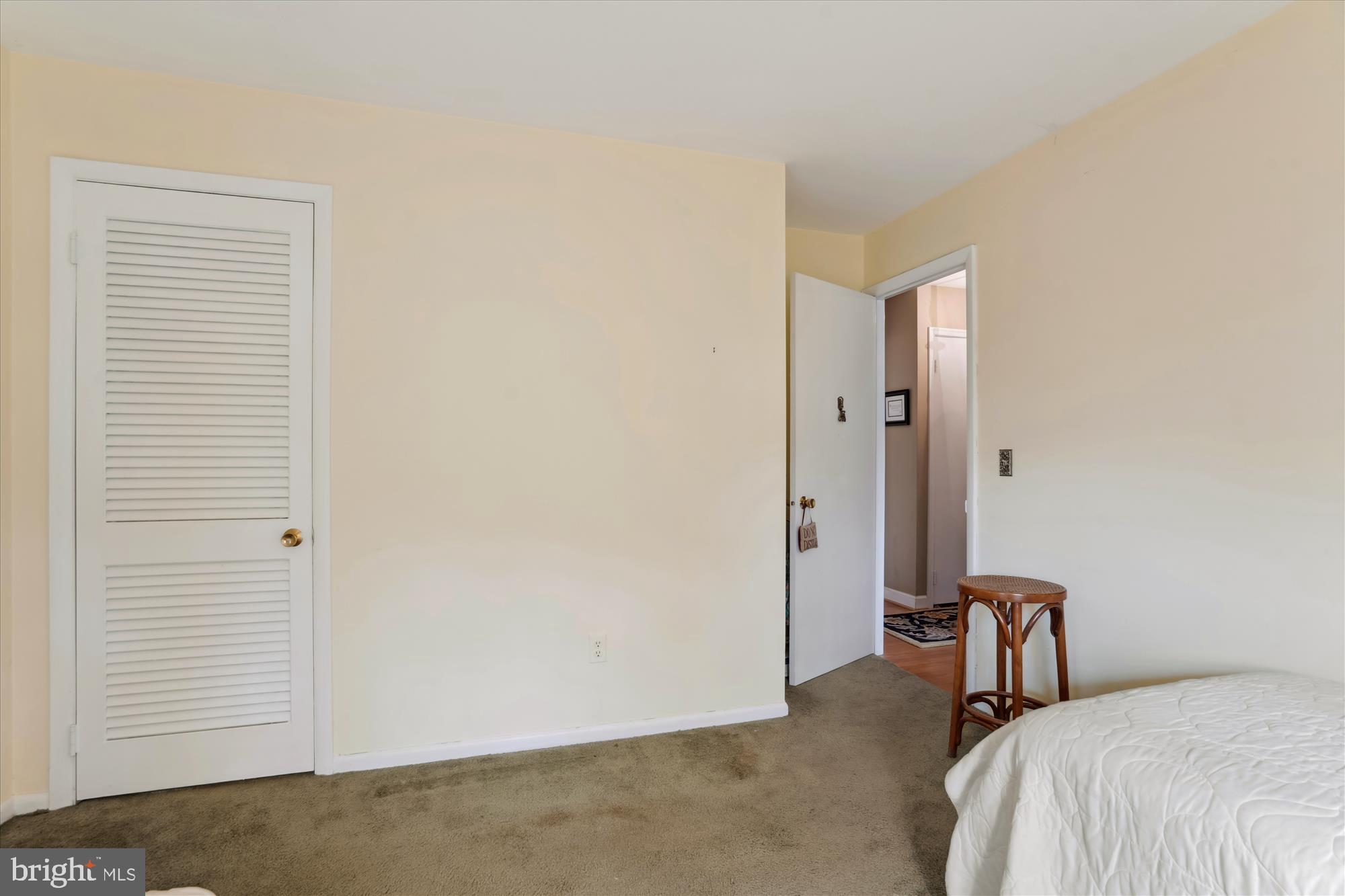 11319 Harding Road Laurel, MD 20723 - Photo 20 of 44 a bedroom with a bed and a night stand