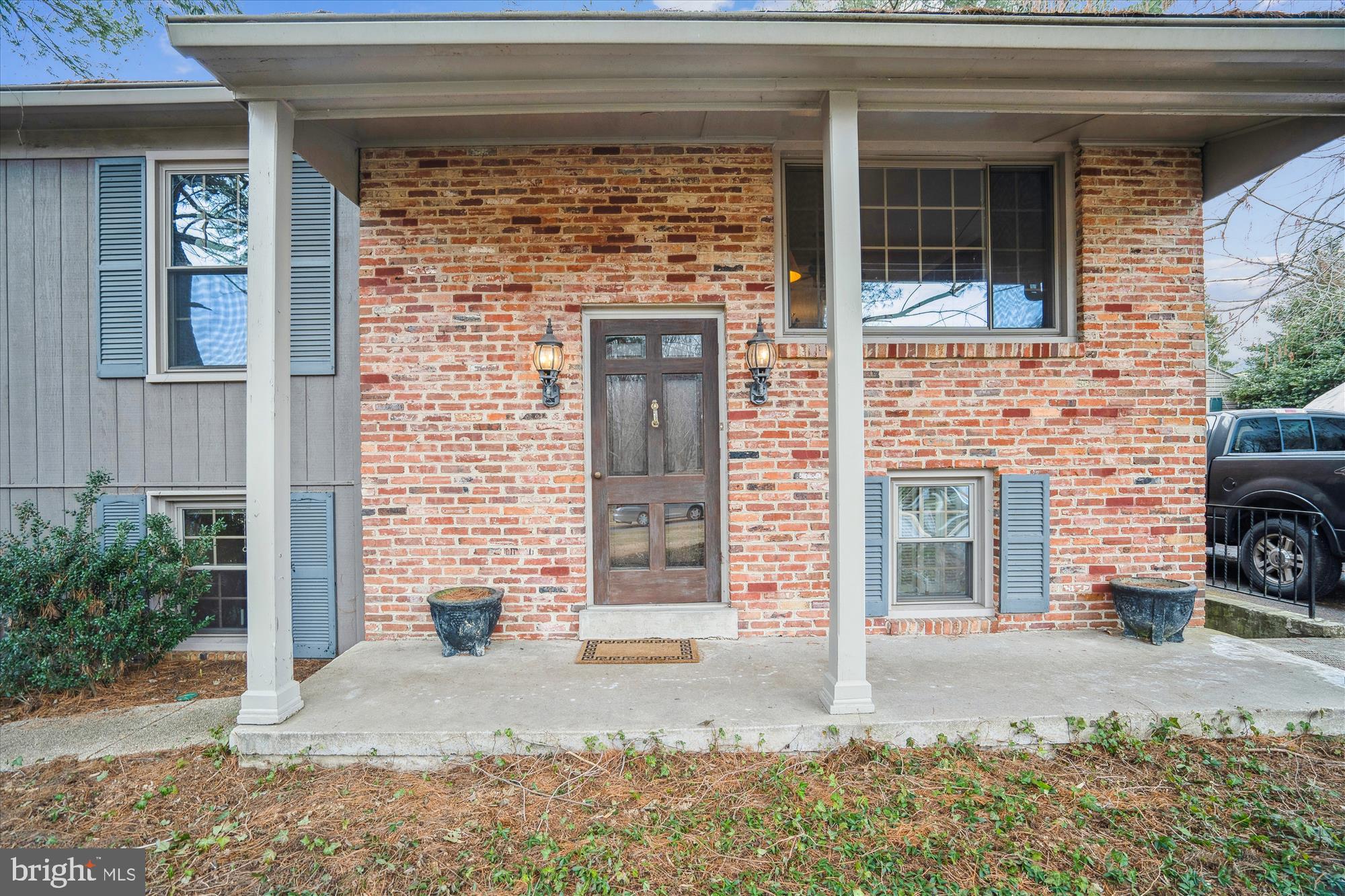 11319 Harding Road Laurel, MD 20723 - Photo 3 of 44 a front view of a house with a yard and garage