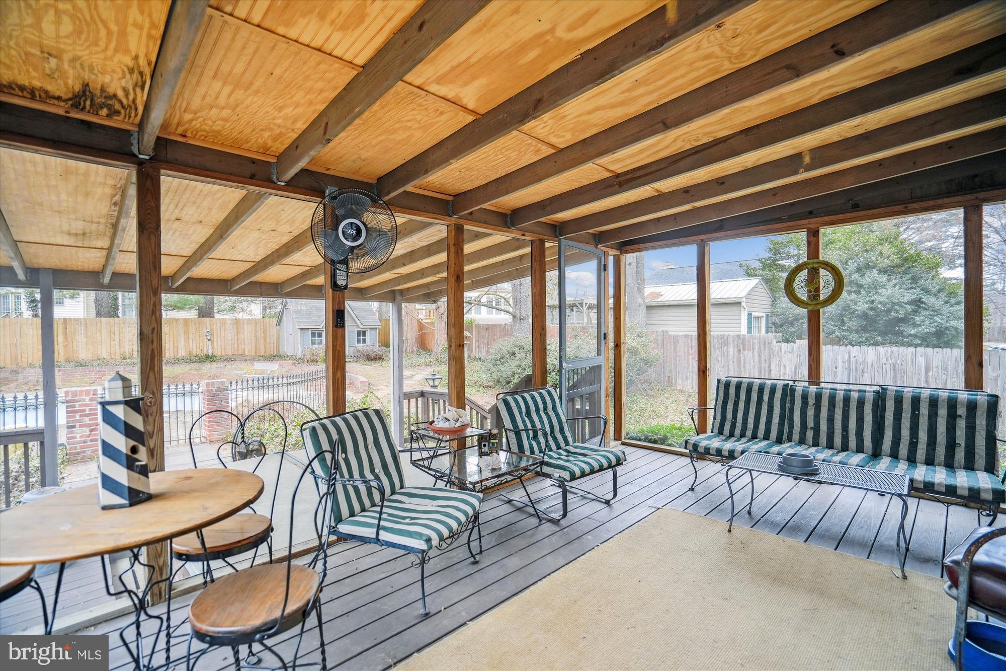 11319 Harding Road Laurel, MD 20723 - Photo 33 of 44 a balcony with furniture and floor to ceiling window