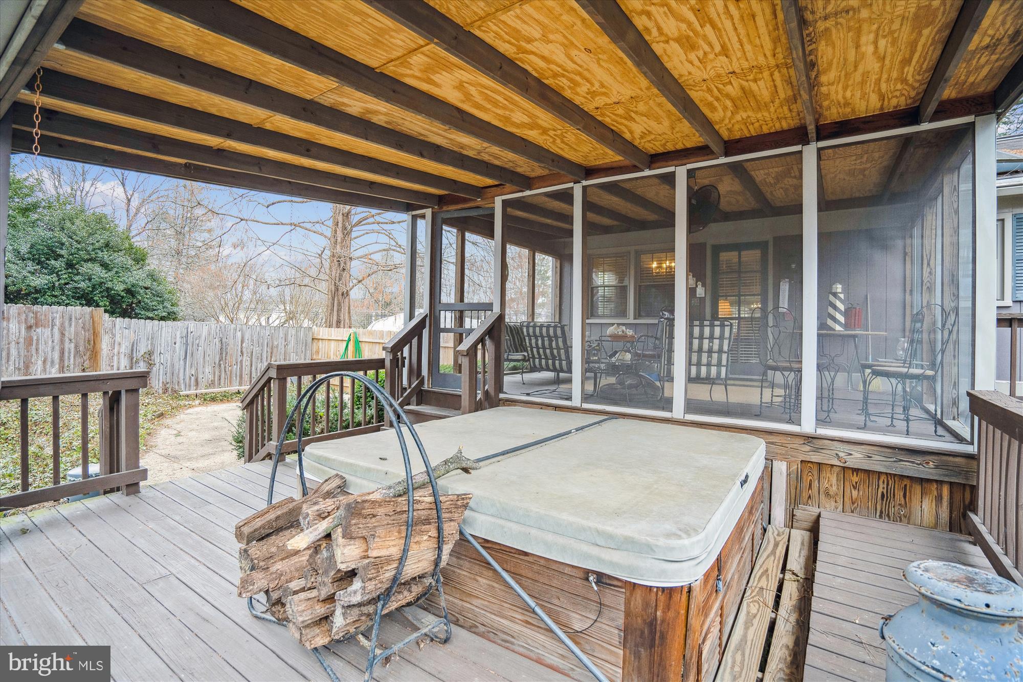 11319 Harding Road Laurel, MD 20723 - Photo 36 of 44 a view of a patio with table and chairs with wooden floor and fence