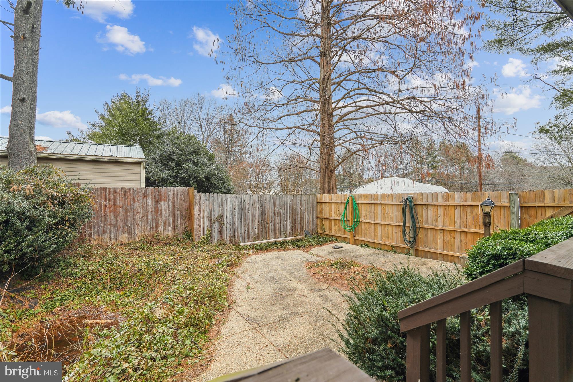 11319 Harding Road Laurel, MD 20723 - Photo 43 of 44 a view of a house with a large tree and wooden fence