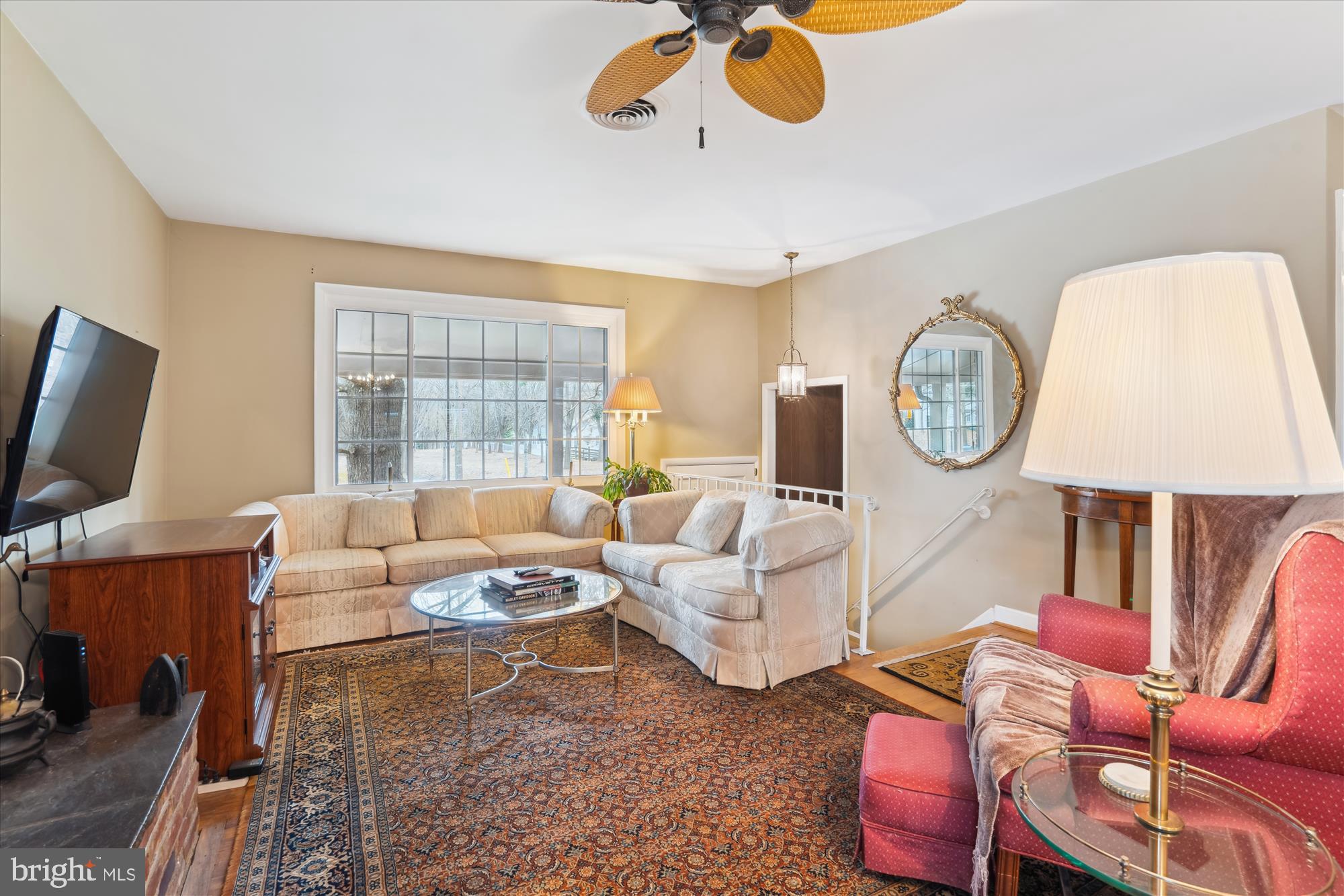 11319 Harding Road Laurel, MD 20723 - Photo 5 of 44 a living room with furniture a flat screen tv and a window
