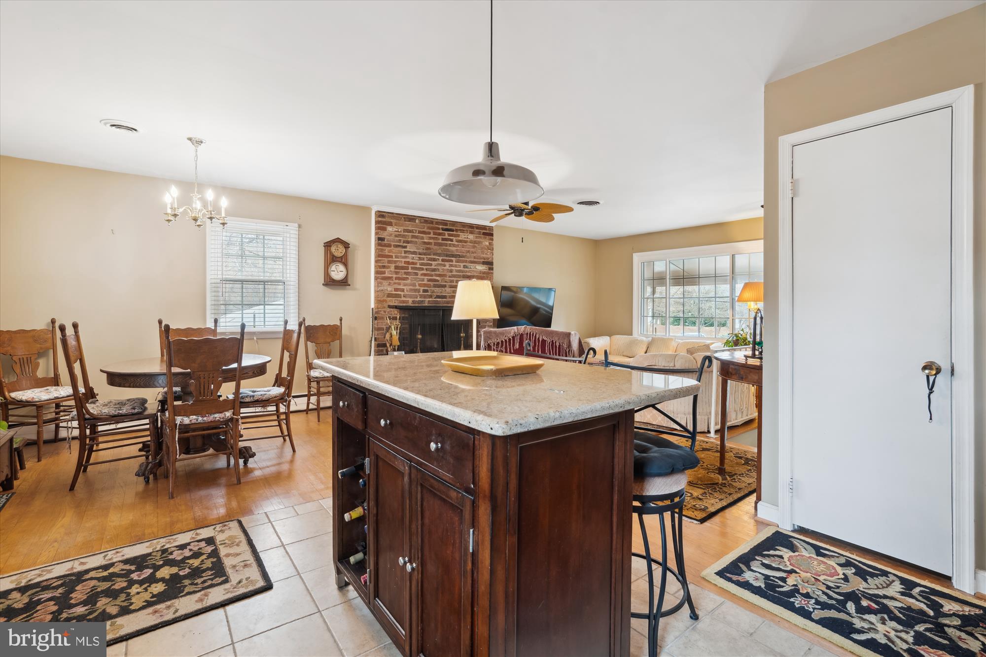 11319 Harding Road Laurel, MD 20723 - Photo 8 of 44 a kitchen with a stove a counter space dining table and chairs
