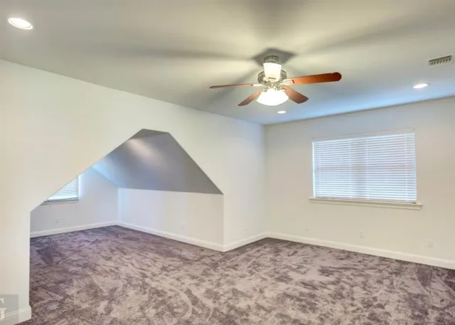 a view of a ceiling fan and a chandelier fan