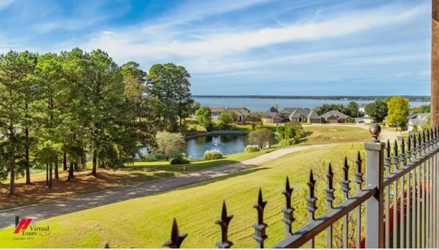 a view of a swimming pool with an outdoor seating