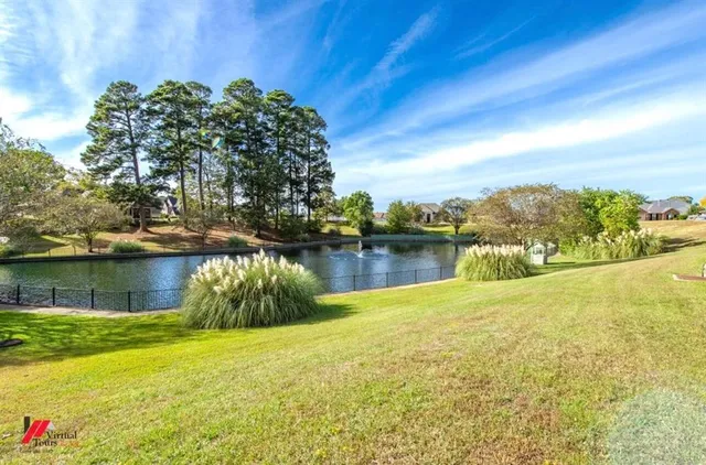 a view of a lake with a big yard