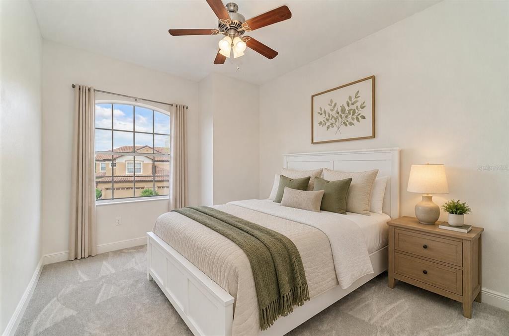 8261 Miramar Way, Unit 202 Lakewood Ranch, FL 34202 - Photo 21 of 36 a bedroom with a bed and a window