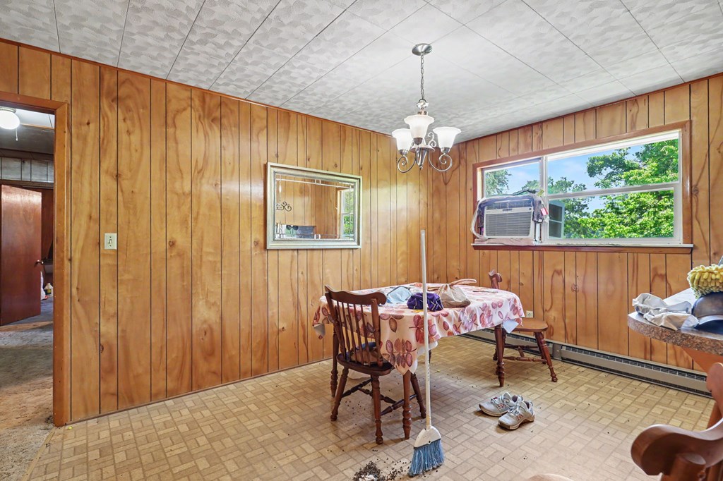 63 Fort Butler Street Murphy, NC 28906 - Photo 11 of 30 a dining room with furniture a chandelier and window
