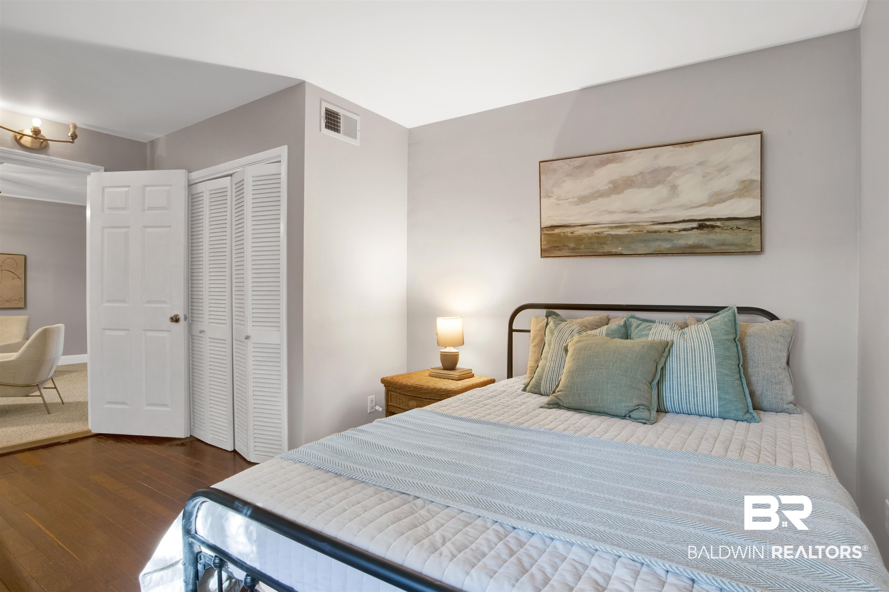 160 Emogene Place Mobile, AL 36606 - Photo 17 of 32 Bedroom featuring dark wood-style floors and a closet