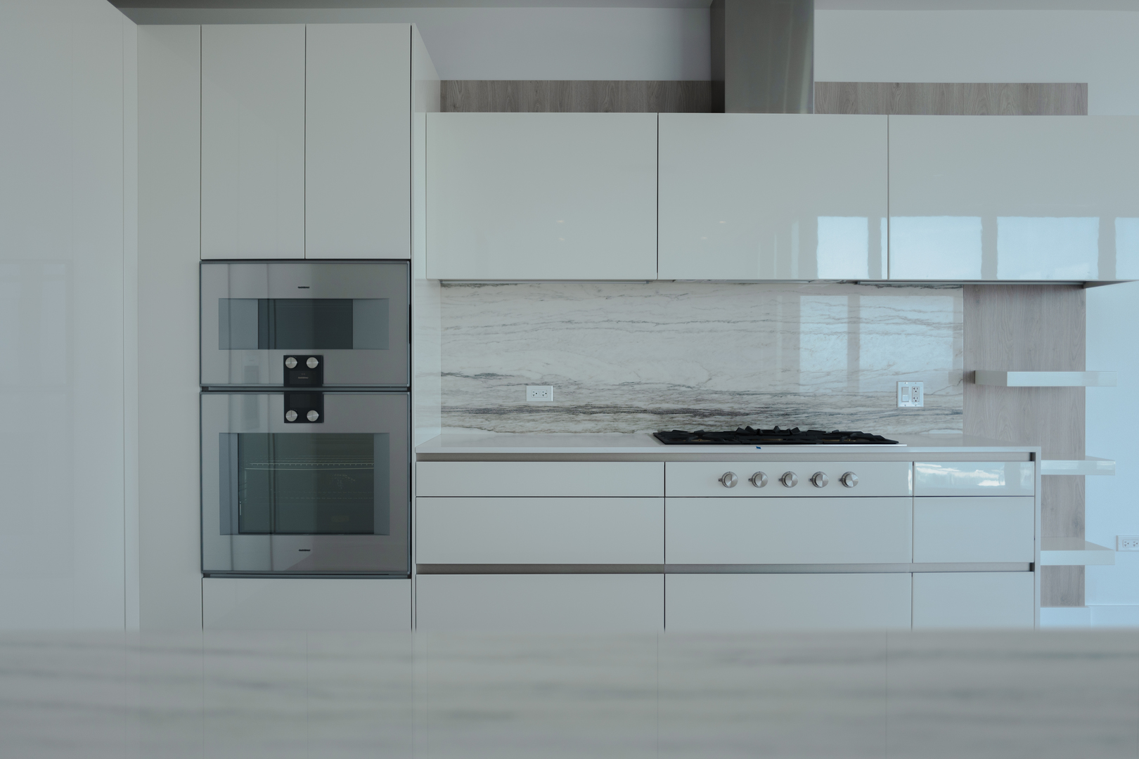 363 East Wacker Drive, Unit 3404 Chicago, IL 60601 - Photo 13 of 22 a kitchen with granite countertop white cabinets and white appliances