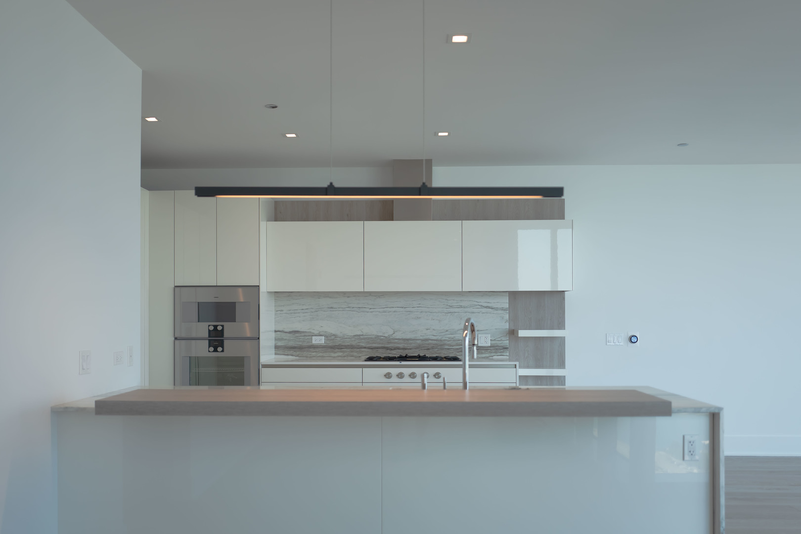 363 East Wacker Drive, Unit 3404 Chicago, IL 60601 - Photo 15 of 22 a kitchen with a sink and cabinets