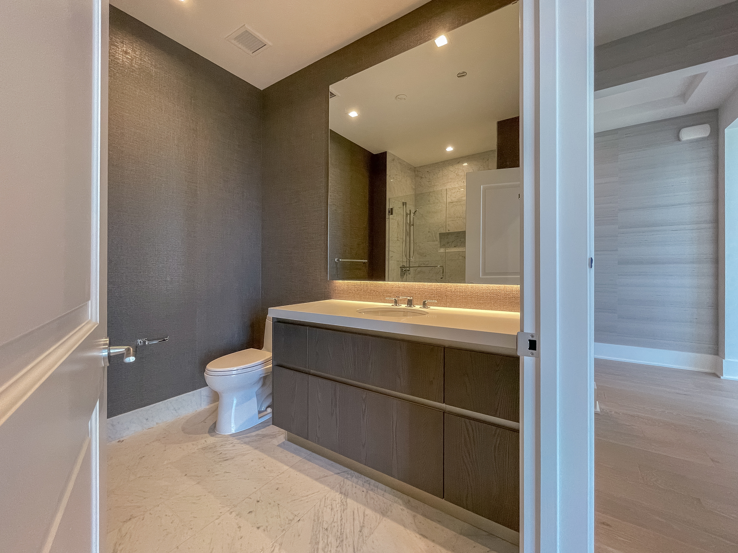 363 East Wacker Drive, Unit 3404 Chicago, IL 60601 - Photo 5 of 22 a bathroom with a sink a toilet and shower