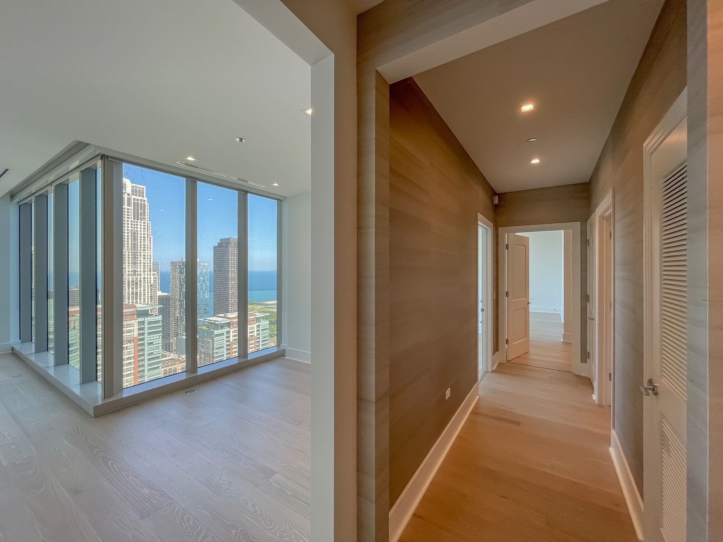 363 East Wacker Drive, Unit 3404 Chicago, IL 60601 - Photo 8 of 22 a view of a hallway with wooden floor