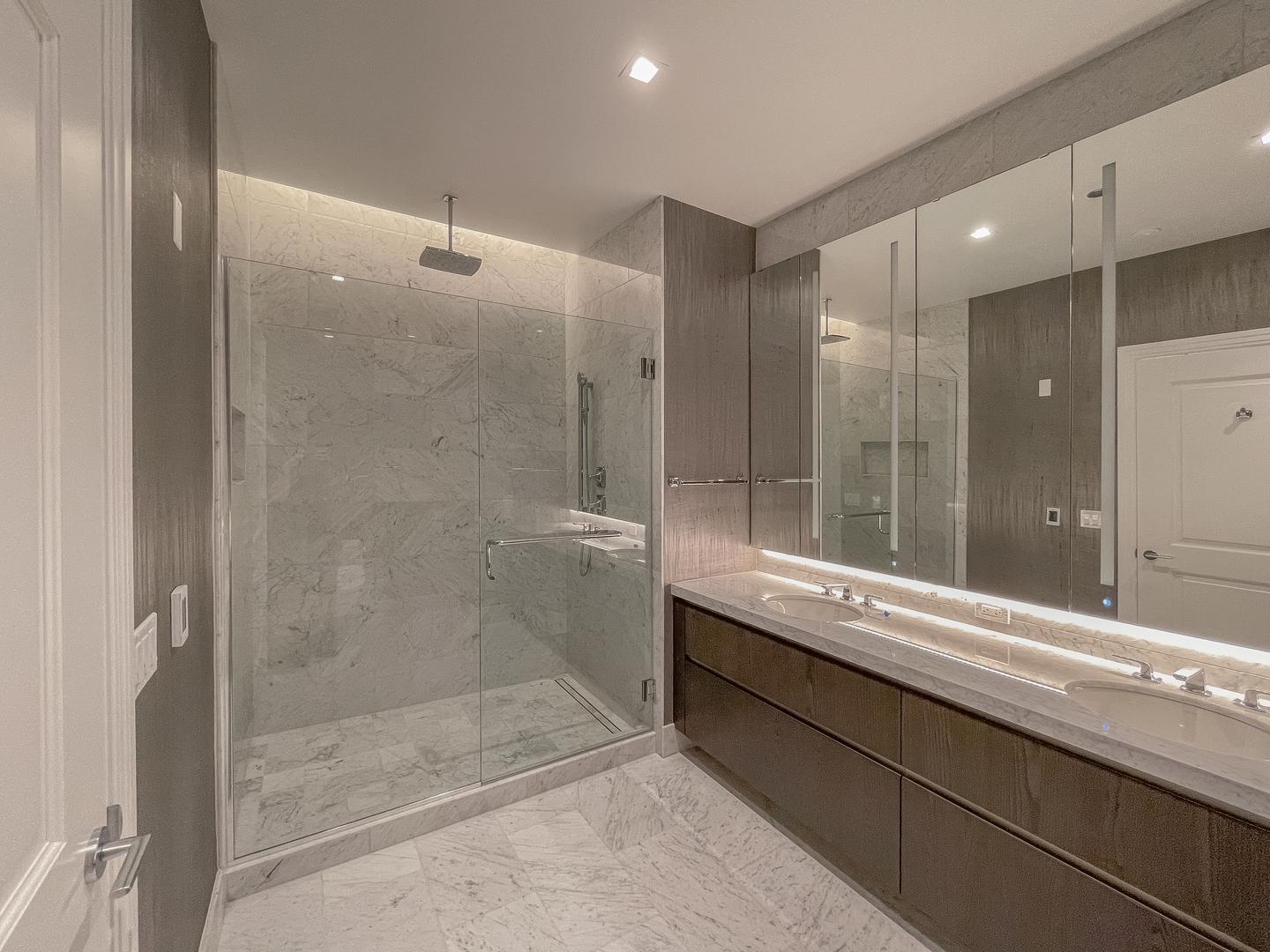 363 East Wacker Drive, Unit 3404 Chicago, IL 60601 - Photo 9 of 22 a bathroom with a double vanity sink mirror and shower