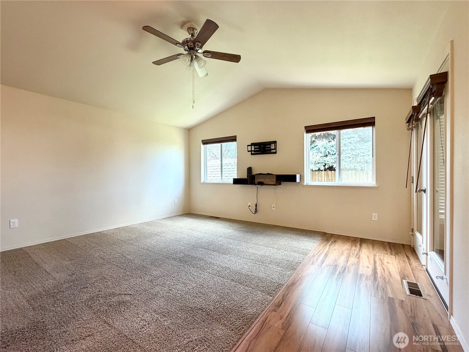 709 Paintbrush Lane Omak, WA 98841 - Photo 14 of 40 wooden floor in an empty room with a window