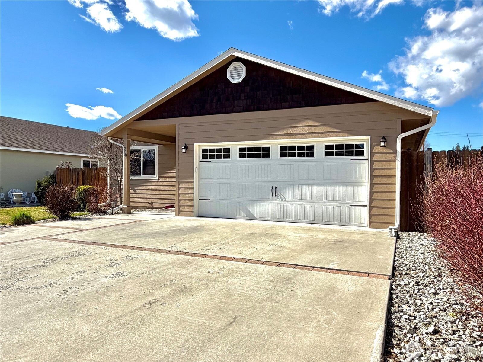 709 Paintbrush Lane Omak, WA 98841 - Photo 3 of 40 a front view of a house with a garage