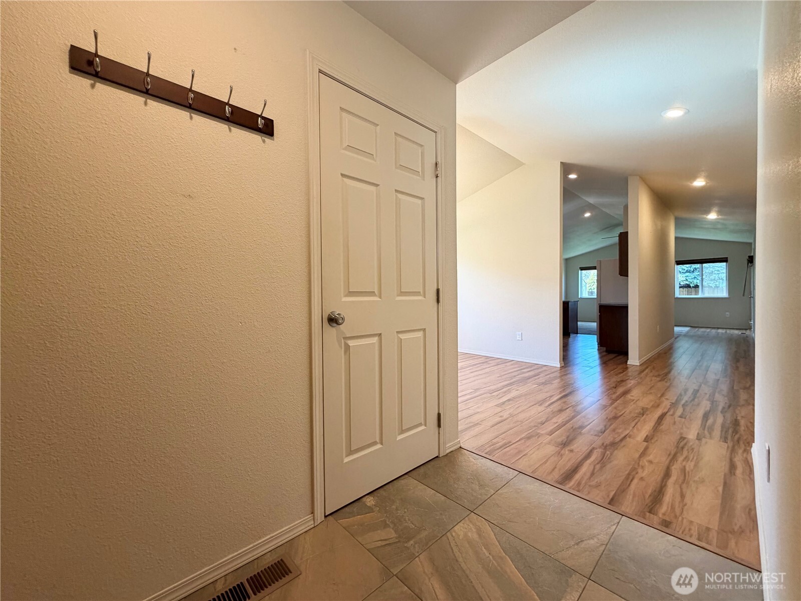 709 Paintbrush Lane Omak, WA 98841 - Photo 4 of 40 a view of a hallway with wooden floor
