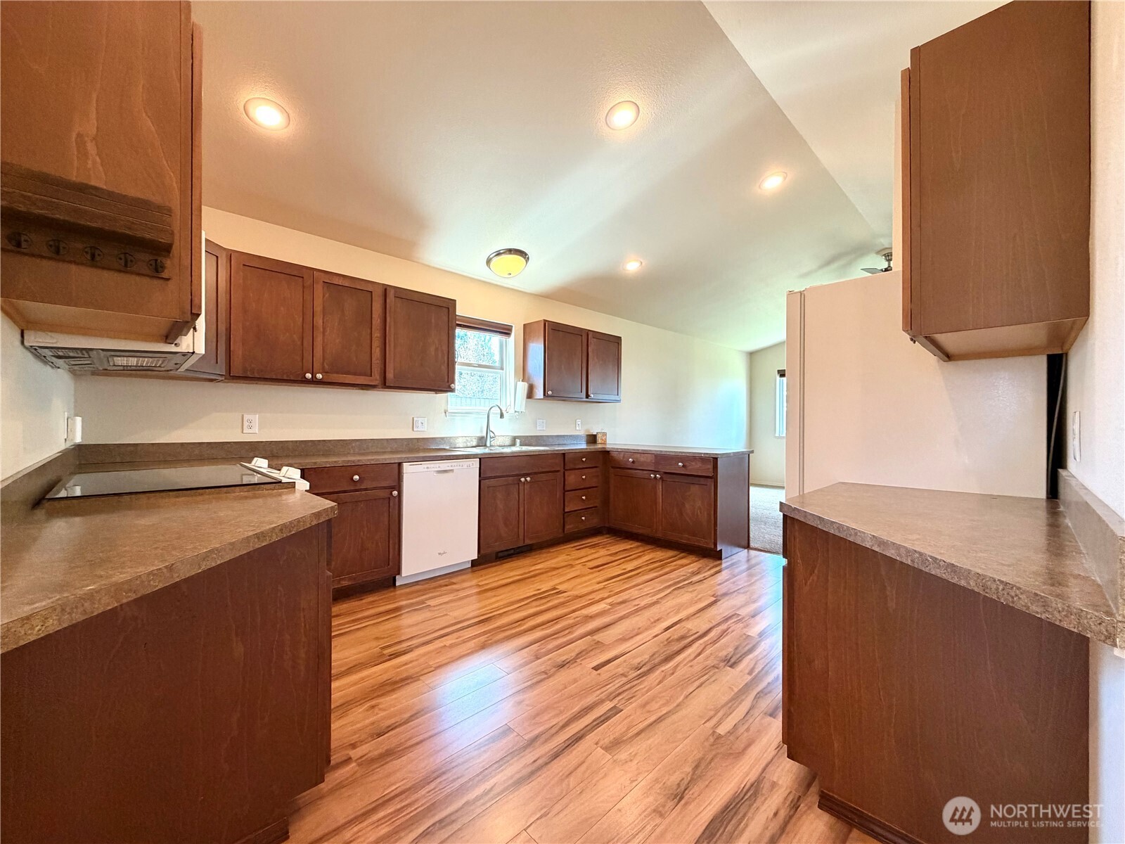 709 Paintbrush Lane Omak, WA 98841 - Photo 10 of 40 a large kitchen with stainless steel appliances granite countertop a sink counter space and cabinets