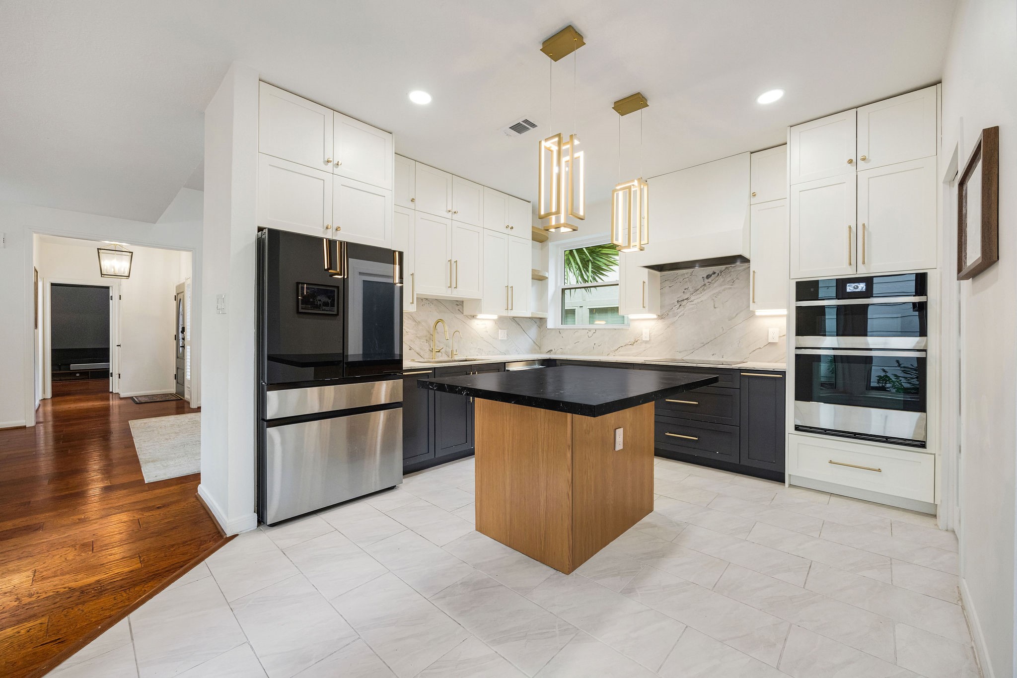 727 Bunker Hill Road, Unit 26 Houston, TX 77024 - Photo 8 of 25 Welcome to your chef's kitchen with high-end appliances, center island and custom cabinetry.