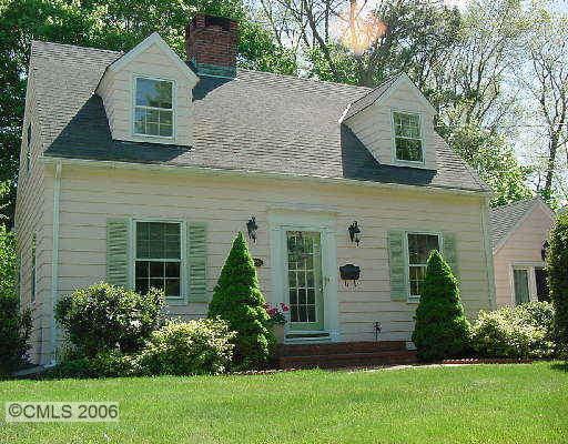 22 Highbrook Road Norwalk, CT 06851 - Photo 1 of 1 a front view of a house with a garden