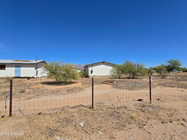 a view of a yard and front view of a house
