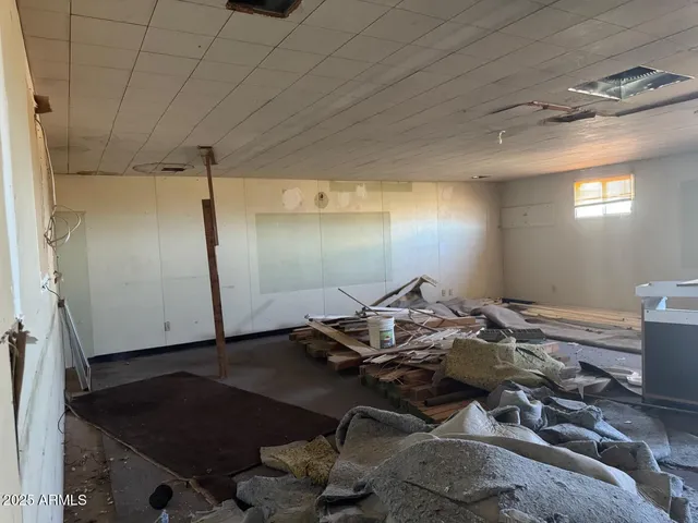 a room with a sink and a mirror