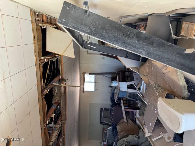 a room with a mirror and furniture