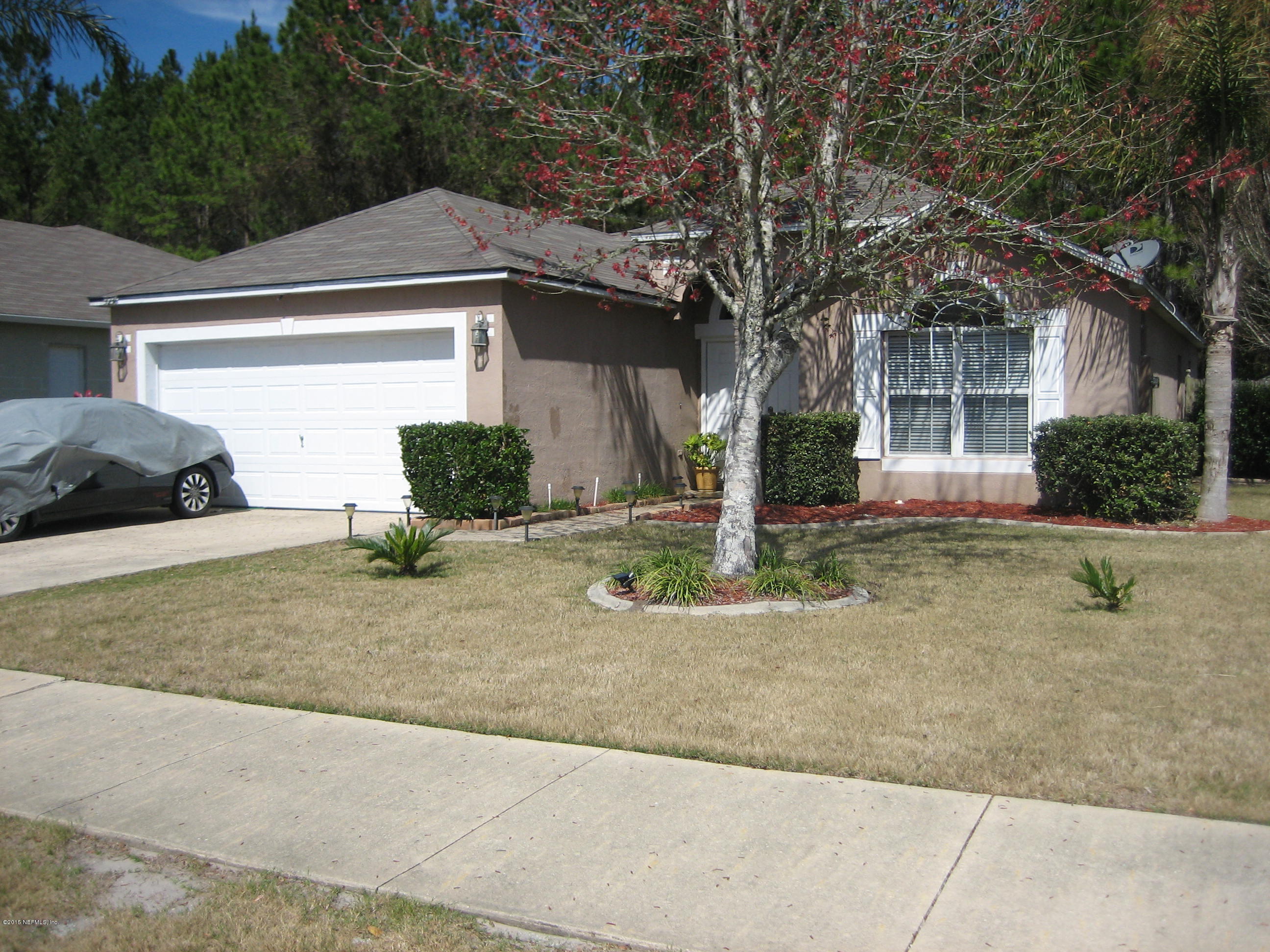 3236 Carlotta Road Middleburg, FL 32068 - Photo 1 of 18 a front view of a house with garage