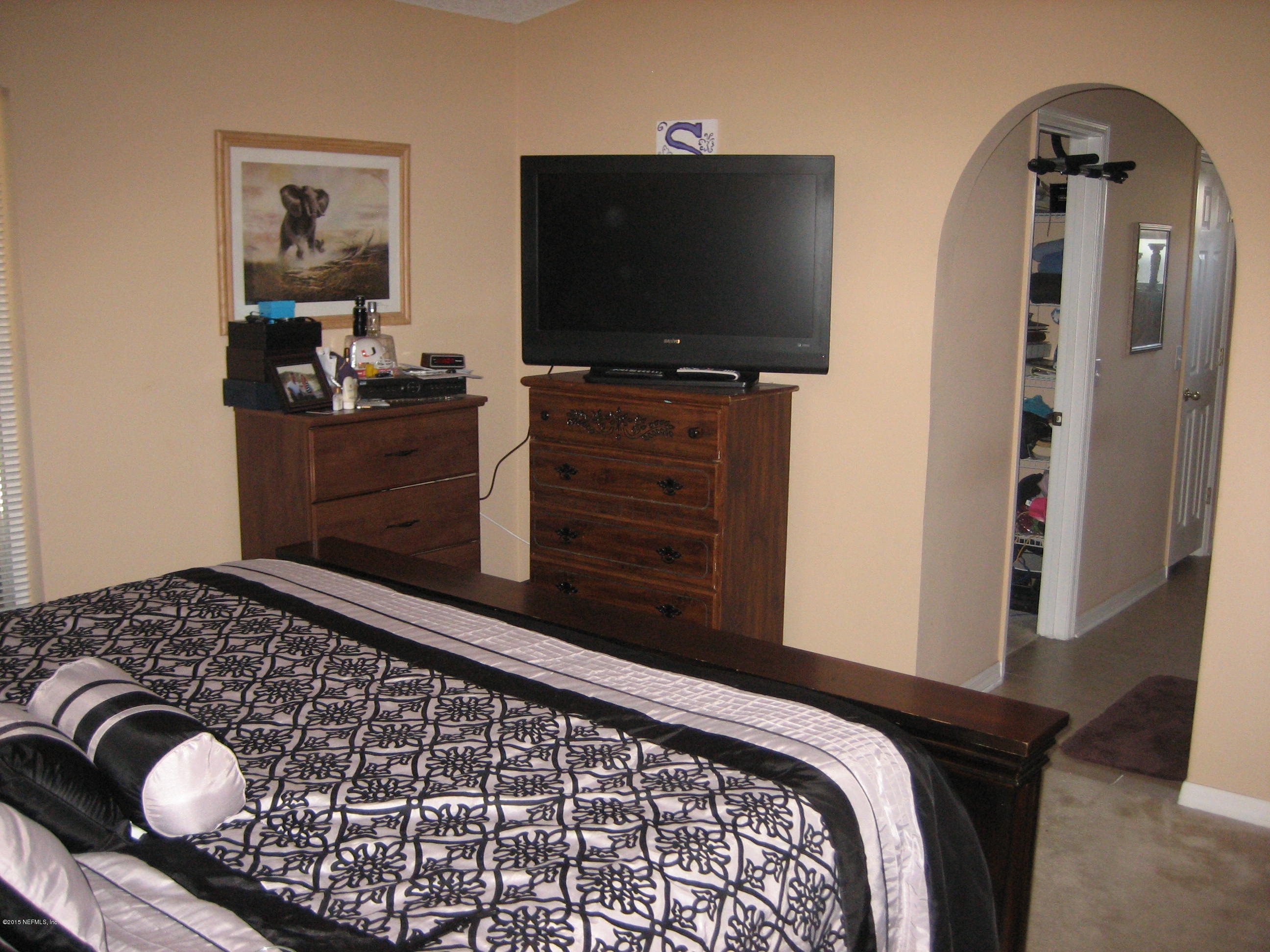 3236 Carlotta Road Middleburg, FL 32068 - Photo 11 of 18 a bedroom with a bed and television