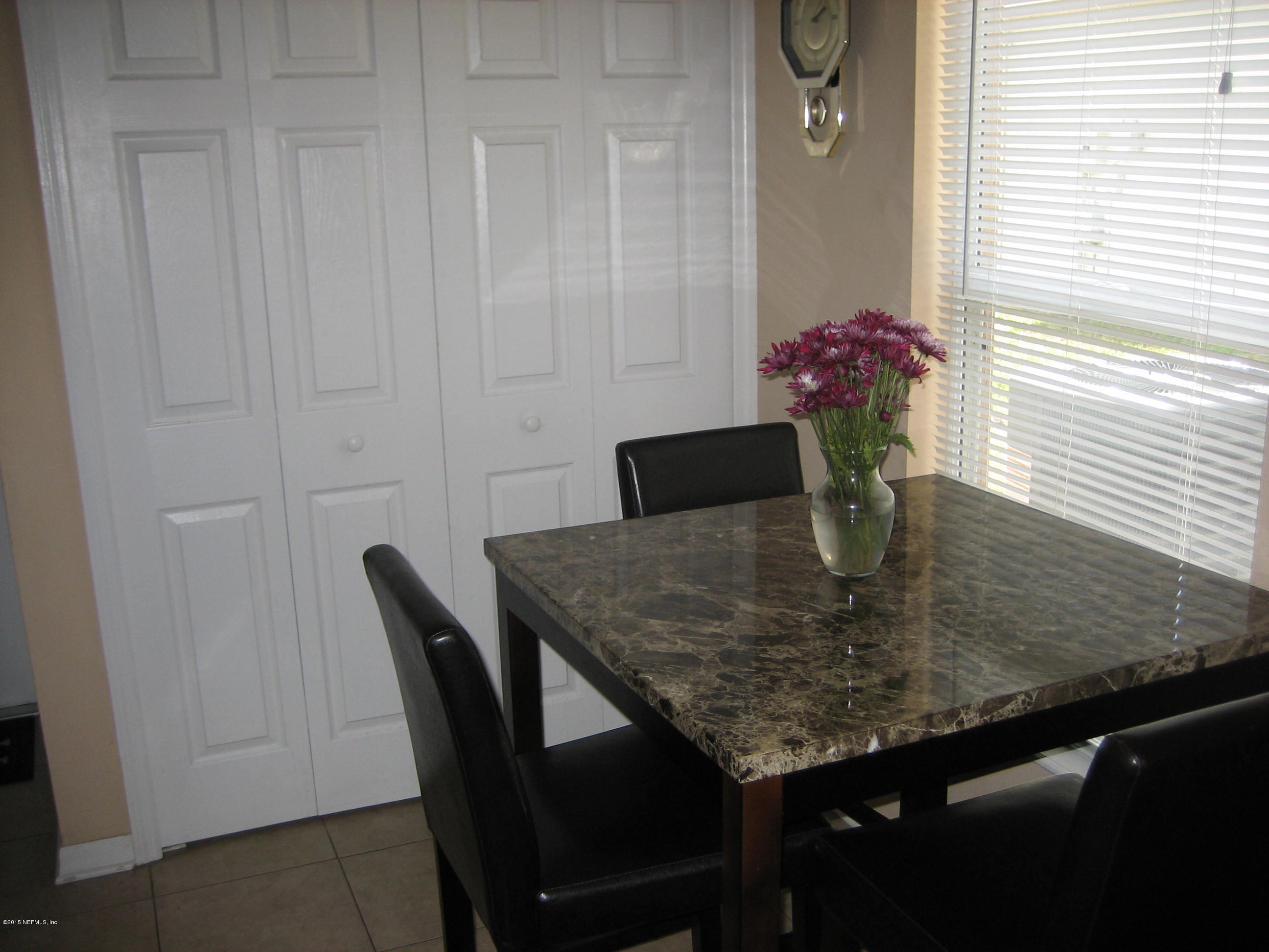 3236 Carlotta Road Middleburg, FL 32068 - Photo 5 of 18 a view of a dining room with furniture and wooden floor