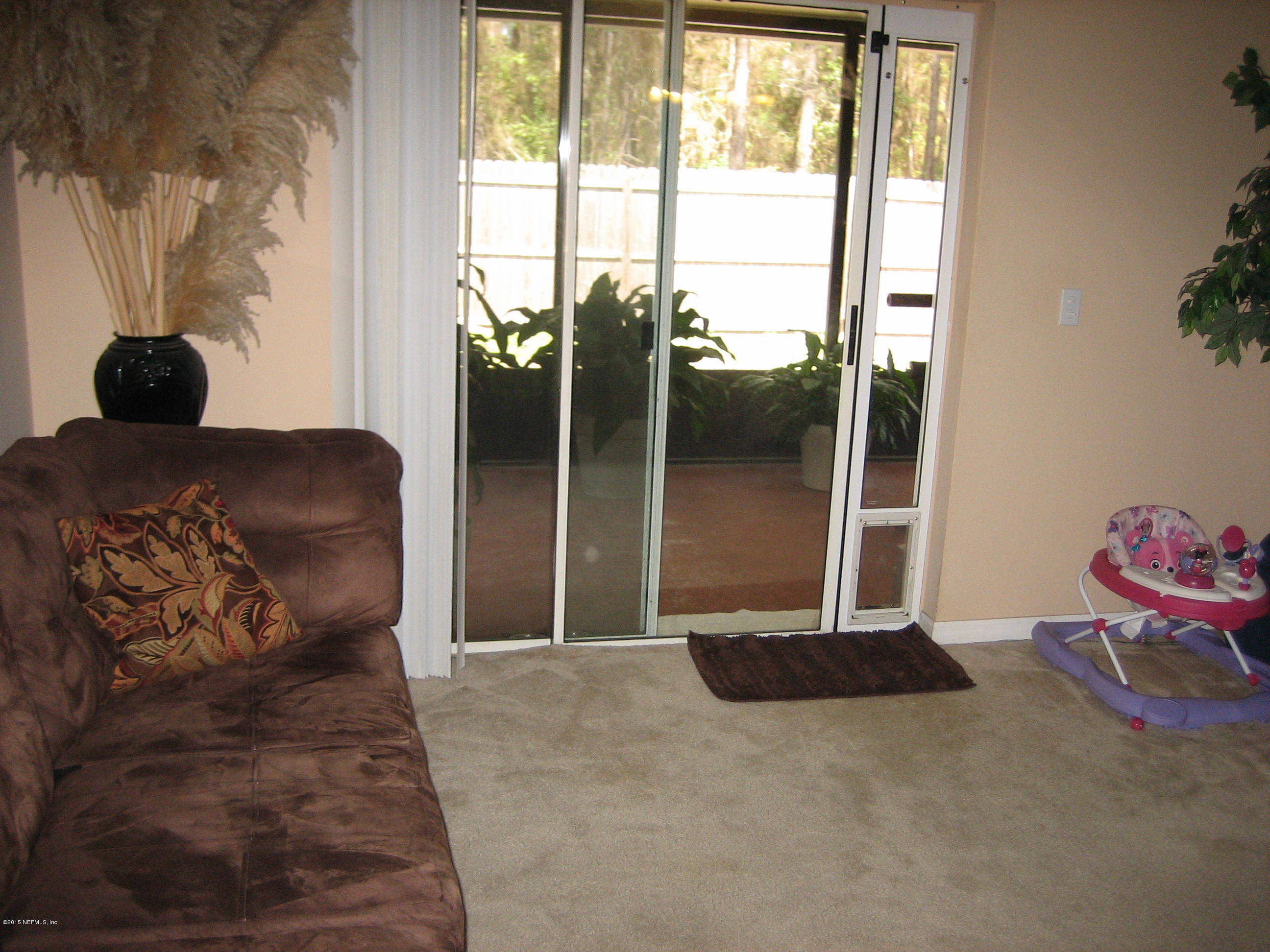 3236 Carlotta Road Middleburg, FL 32068 - Photo 8 of 18 a living room with a couch