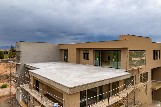 271 North Country Lane, Unit 60 St. George, UT 84770 - Photo 7 of 17 Back of house featuring stucco siding