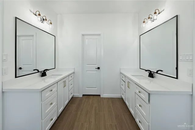 a bathroom with a shower a mirror and a sink