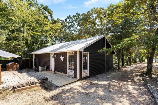 a view of a house with a yard and garage