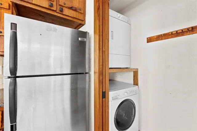 a view of a hallway with washer and dryer