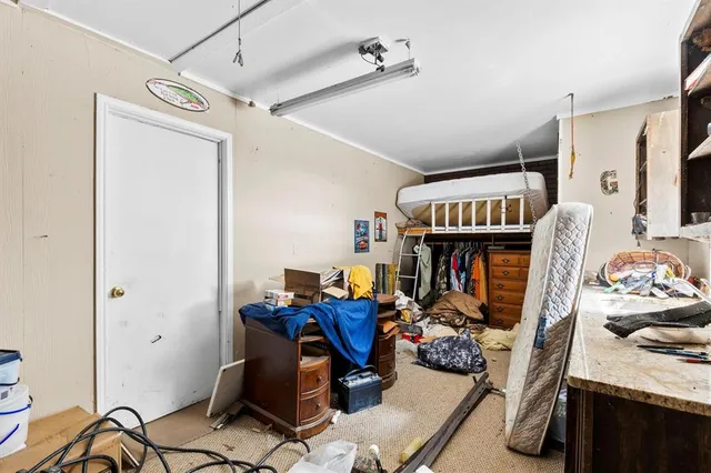 a work room with furniture and gym equipment