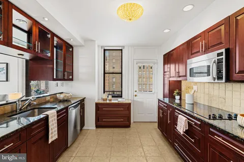 a bedroom with a bed furniture and a window