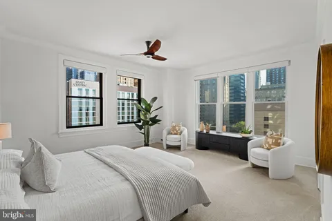 a bathroom with a double vanity sink mirror and shower