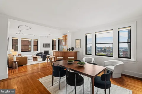 a view of a dining room with furniture window and wooden floor