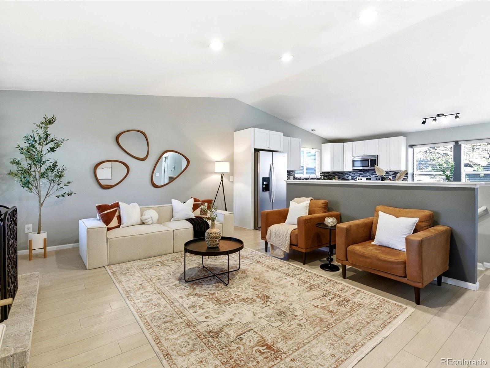 a living room with furniture and a rug