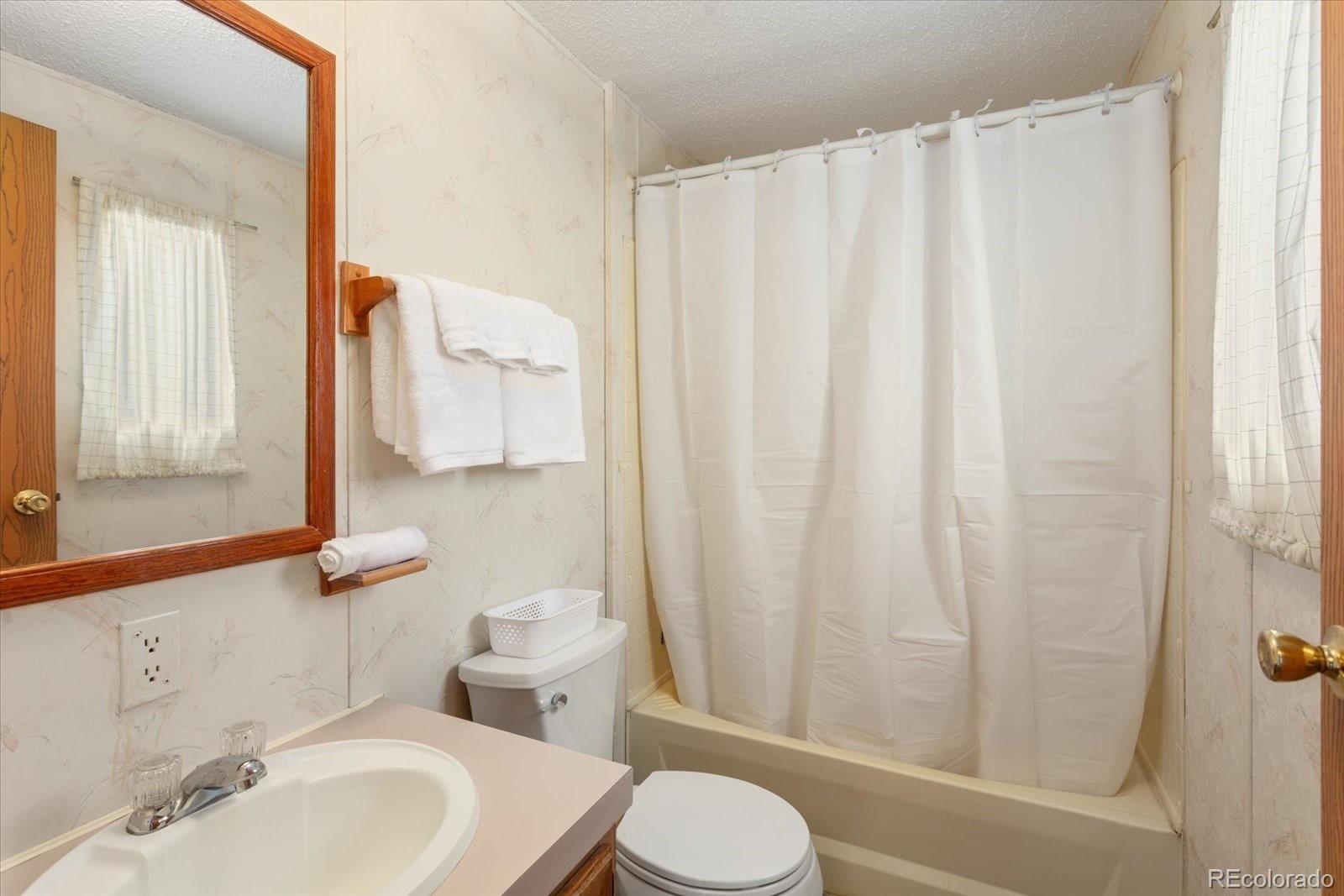 2275 K Path Cotopaxi, CO 81223 - Photo 18 of 28 a bathroom with a sink toilet and shower
