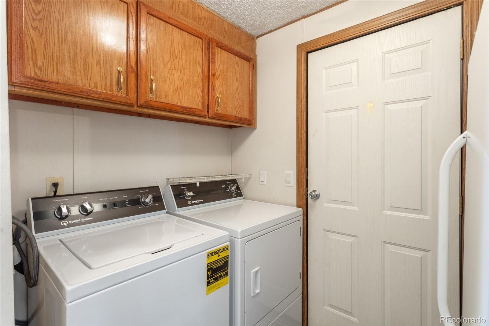 2275 K Path Cotopaxi, CO 81223 - Photo 19 of 28 a utility room with dryer and washer
