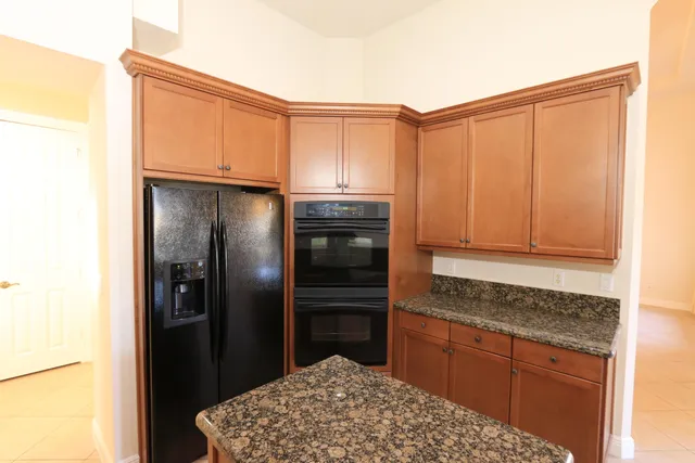 a view of a kitchen with wooden floor