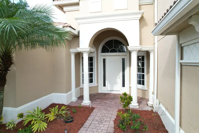 a kitchen with granite countertop a sink and a stove