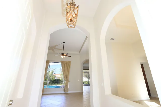 a kitchen with stainless steel appliances granite countertop a refrigerator and a stove